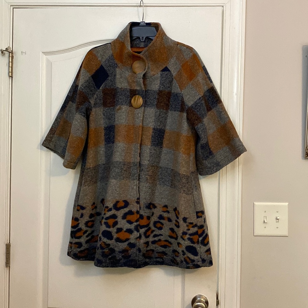 This pea coat was designed by Luii. It is a size medium but runs a little large.